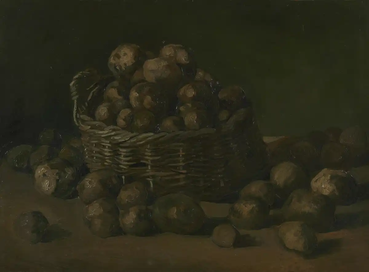 Dark-toned oil painting of a wicker basket heaped with potatoes, more potatoes scattered on the table in front.