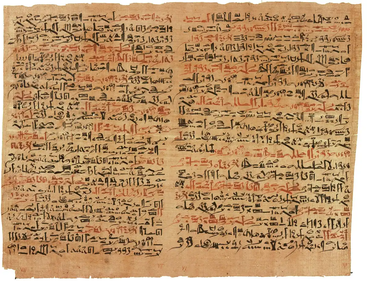 Two plates of the Edwin Smith surgical papyrus, columns of hieratic script in black and red.