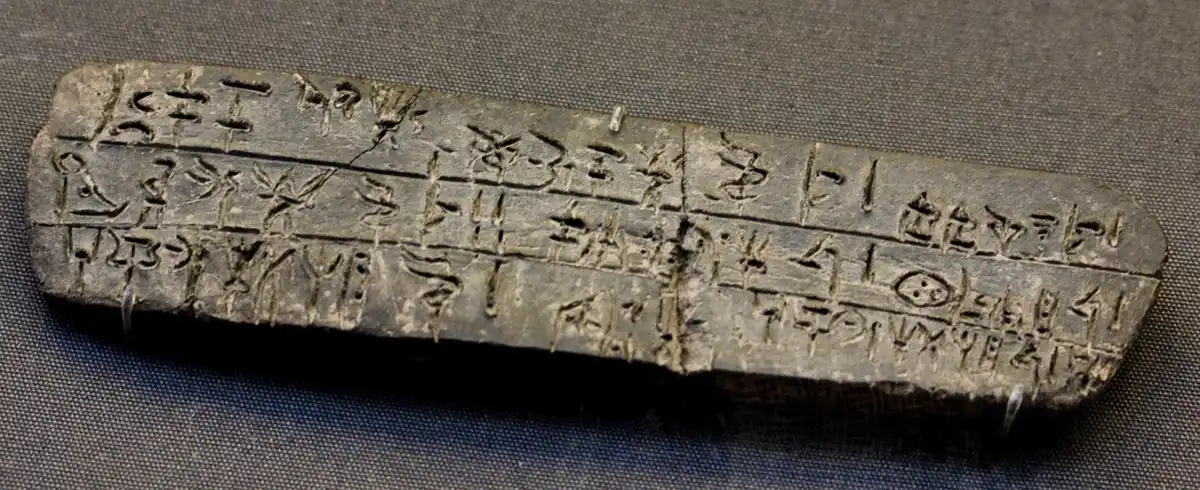 Clay tablet inscribed with rows of Linear B script.